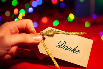 Danke - text on the label in a woman's hand.