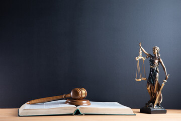 Judge gavel and scales of justice and book