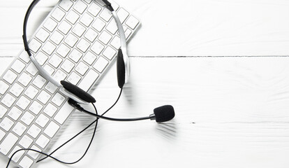 earphone on keyboard on table