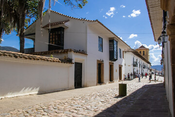 Fototapeta na wymiar Beautiful streets and facades of the historical houses of Villa de Leyva city located on the Boyaca department in Colombia