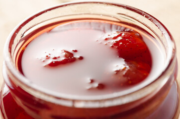 Strawberry Jam with whole berries, closeup.