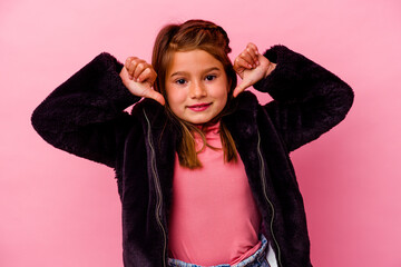 Little caucasian girl isolated on pink background