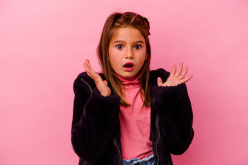 Little caucasian girl isolated on pink background