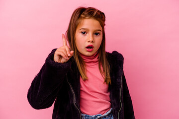 Little caucasian girl isolated on pink background
