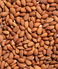 Roasted peeled almond nuts texture, top view. Almond nuts background. Healthy snack