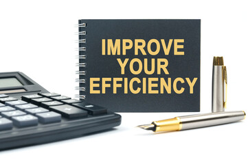 On a white background, there is a calculator, a pen and a black notebook with the inscription - IMPROVE YOUR EFFICIENCY
