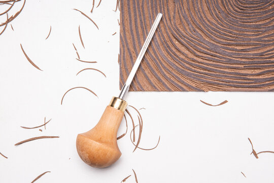 Linocut Tools With Linoleum Pieces On Table After Cuting Brown Linoleum