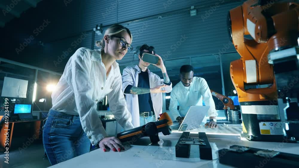 Wall mural researchers are using vr-device for a robotics experimentprofessional engineers working with innovat