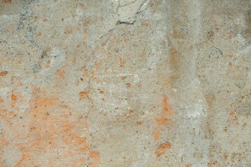 texture of an old concrete surface with chips and stains. A dilapidated, worn-out wall with a plaster base. Old vintage textures and backgrounds