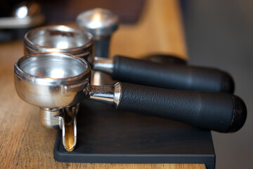 espresso machine holders on rubber pad at table, closeup