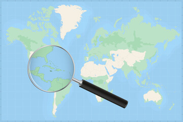 Fototapeta premium Map of the world with a magnifying glass on a map of Jamaica.