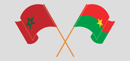 Crossed and waving flags of Morocco and Burkina Faso