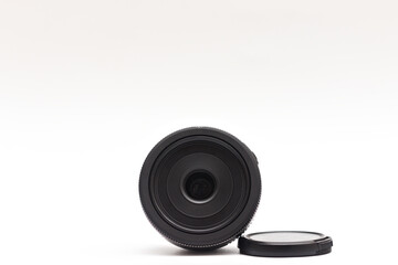 Untitled Small Black 24mm pancake Lens with Caps Removed for DSLR Camera