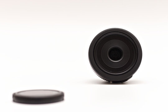 Untitled Small Black 24mm Lens with Caps Removed for DSLR Camera
