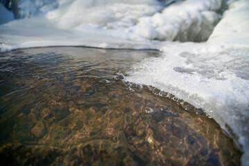 Ice texture. Frozen mountain stream. Bizarre ice shapes. Frozen water