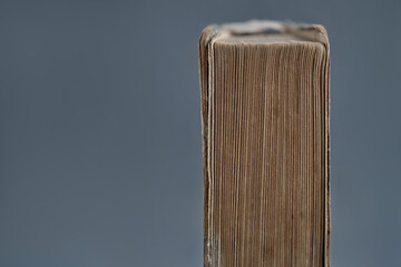 Top of an old book - on a gray background