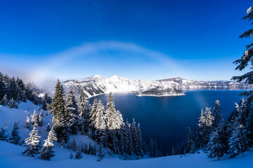 Snow Bow over Crater Lake Oregon