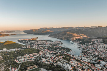 Aerial drone shot of Lapad Dubrovnik bridge with sunrise over peak in Croatia summer morning