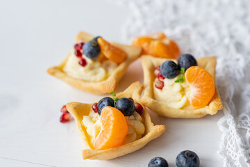 lemon orange clementine  curd custard cream tartlets with fresh fruit 