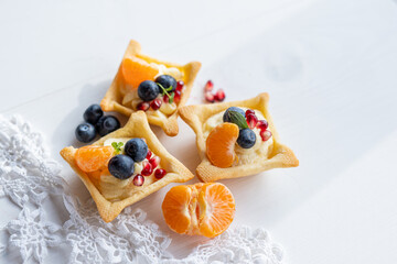lemon orange clementine  curd custard cream tartlets with fresh fruit 