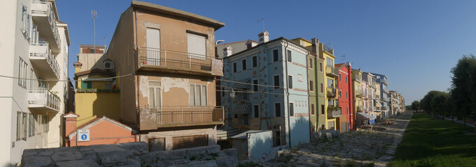 Sottomarina, Murazzi are ancient Istrian stone walls built in order to defend the colorful buildings from sea erosion