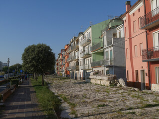 Sottomarina, Murazzi are ancient Istrian stone walls built in order to defend the colorful buildings from sea erosion