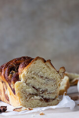 Babka or brioche bread with cinnamon and brown sugar. Homemade pastry for breakfast.