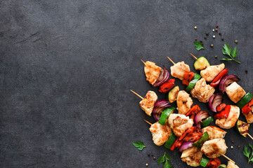 Chicken shashlik and vegetables: peppers, onions, zucchini on skewers. Chicken fillet and grilled vegetables.