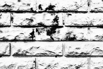 Texture of a brick wall with cracks and scratches which can be used as a background