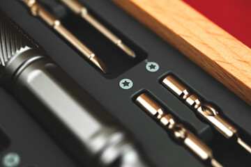 Screwdriver set tool kit close up on macro in wooden box