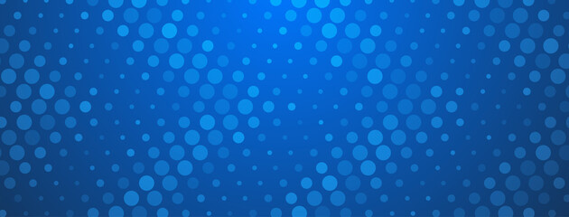 Abstract halftone background made of dots of different sizes in blue colors