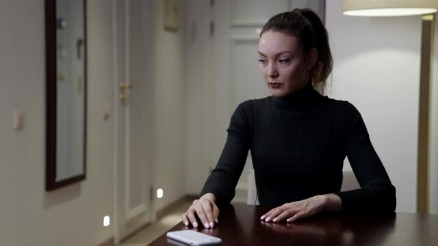 wife is taking mobile phone of husband, checking messages and social nets