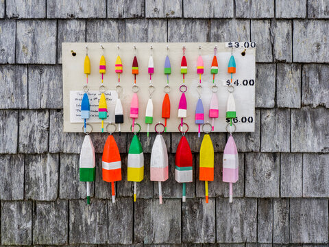 USA, Maine. Handmade buoy keychains in bright colors for sale.