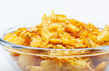 a large bowl of potato chips on white background