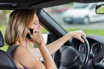 Fototapeta na wymiar female driver talking on the phone