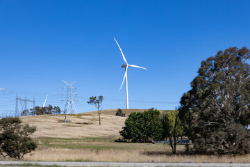 Electricity generating windmill Farms Hume Highway NSW Australia taken from moving car blurred...