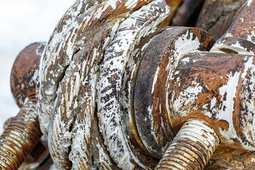 old rusty metal rope wrapped around a spool