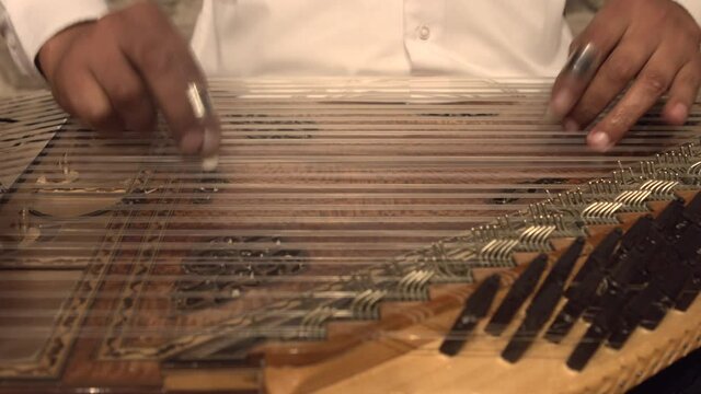 Zither play musical instrument.