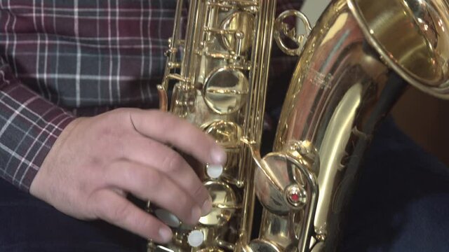 playing saxophone.