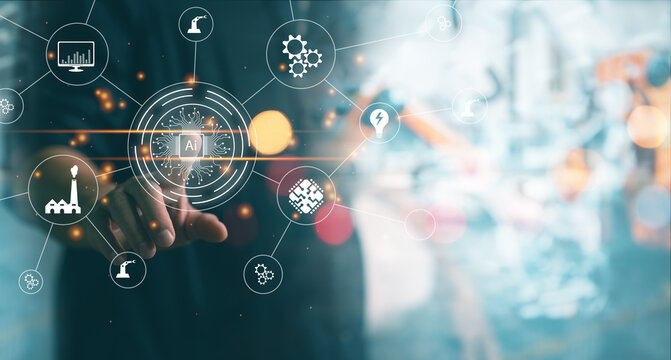 Mechanical engineering pointing on virtual screen working with blur Industrial robotic welding and robot gripping working on smart factory background. industry 4.0 and technology Ai.