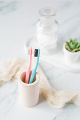 Fluffy toothbrushes in bathroom setting, modern bathroom