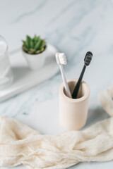 Fluffy toothbrushes in bathroom setting, modern bathroom