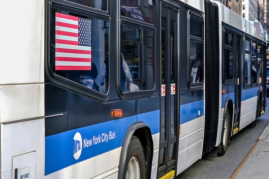 MTA Logo On A Blue And White Color Omnibus In NYC On December 18, 2013. The Metropolitan Transportation Authority (MTA) Is A Public Benefit Corporation Responsible For Public Transportation In NYC.