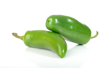 Two hot jalapenos isolated on a white background.