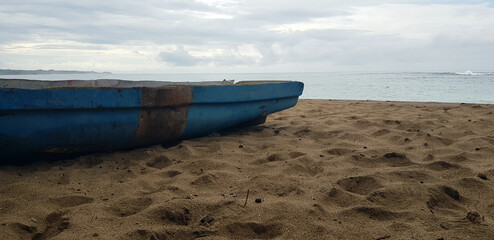 Vintage boat in Caribbean landscape.