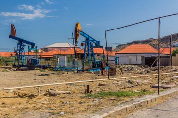 Fototapeta na wymiar Oil derricks in Baku suburbs, Azerbaijan