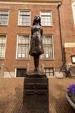 Amsterdam, Netherlands, 05/15/2010: Statue Of Anne Frank, In Front Of Anne Frank House And Museum Where She Stayed With Her Family, Hiding From Nazis During World War Two