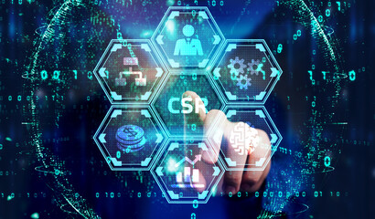 The concept of business, technology, the Internet and the network. A young entrepreneur working on a virtual screen of the future and sees the inscription: CSR