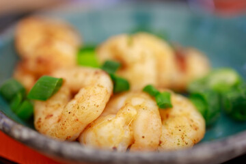 Mediterranean prawns fried in oil and garnished with basil