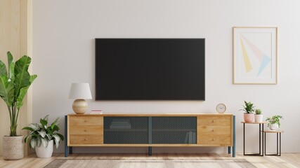 Mockup a TV wall mounted in a living room room with a white wall.